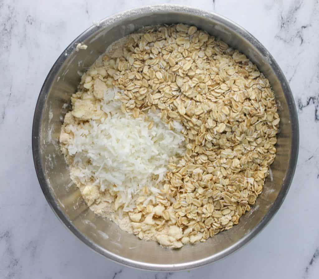 coconut and oats added to bowl
