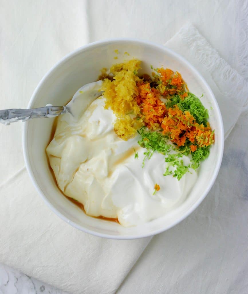 bowl of sour cream, citrus zest, and vanilla extract