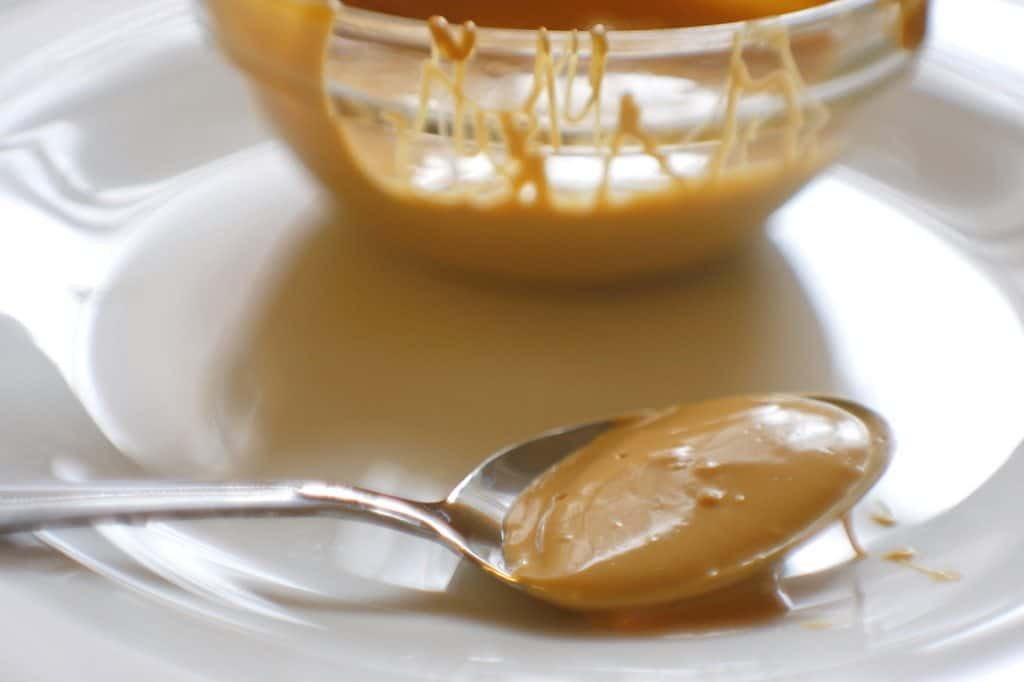 spoon of caramelized white chocolate on a plate