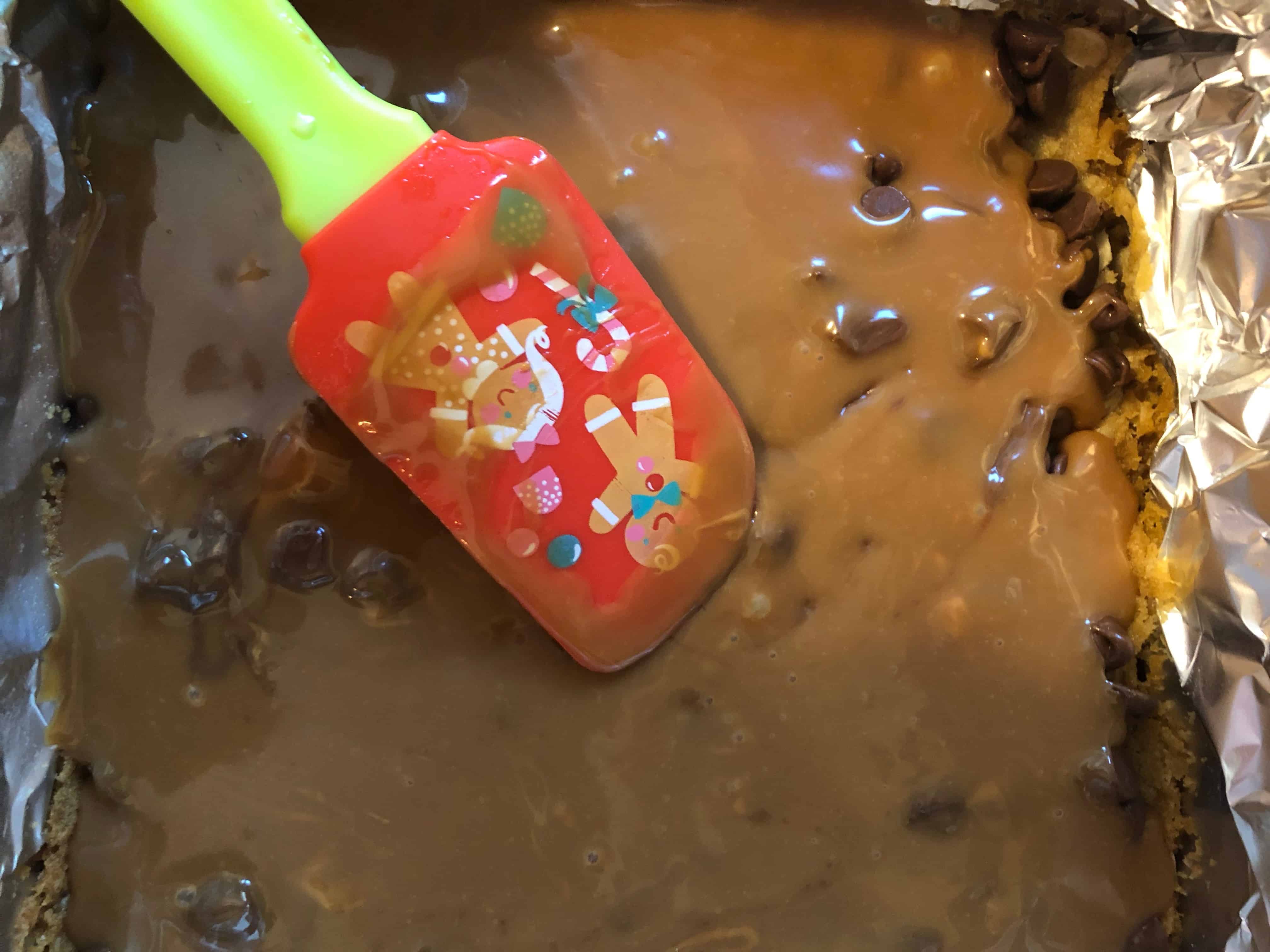 caramel sauce poured over chocolate chips