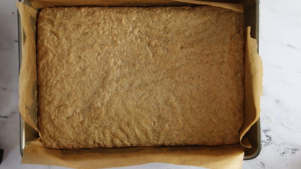baked graham cracker smores bar base in a pan
