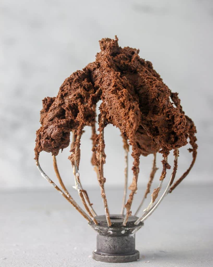 chocolate cookie dough on a whisk attachment