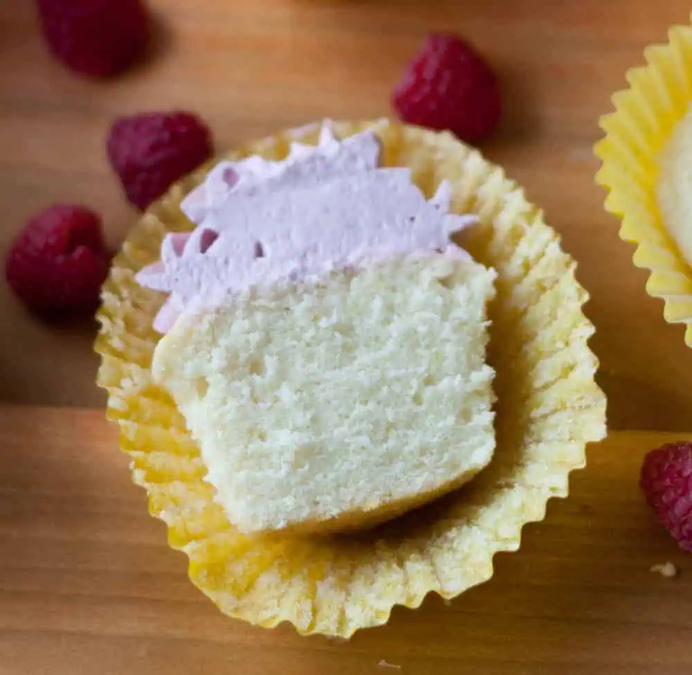 Lemon cupcake recipe with berry buttercream lemon cupcake cut in half