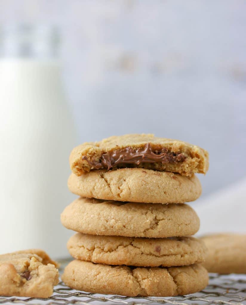 a stack of peanut butter nutella stuffed cookies