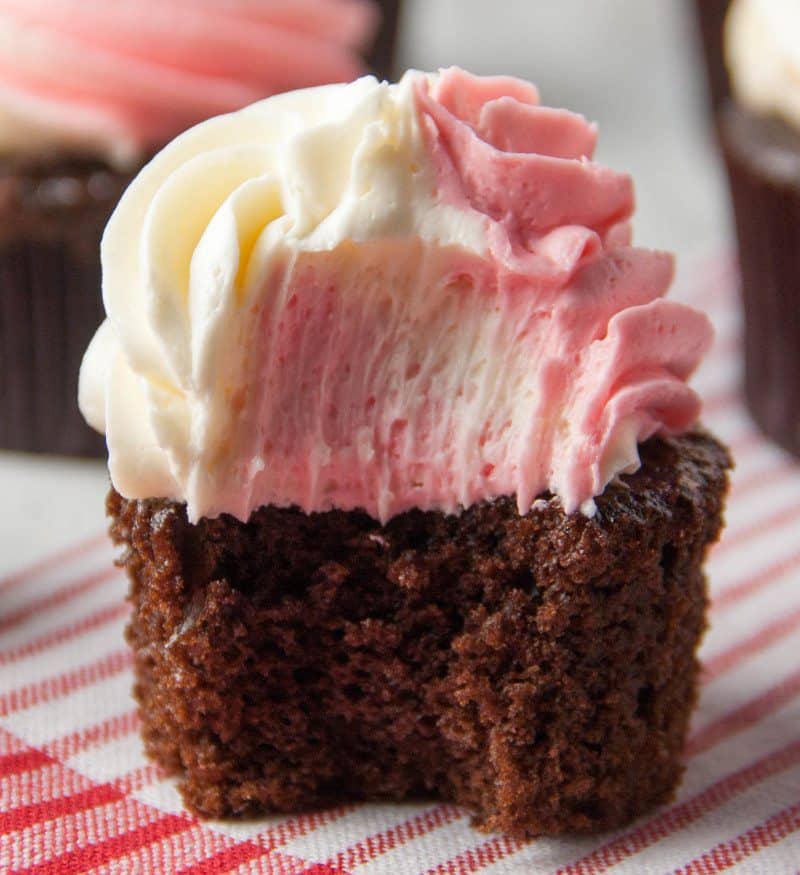 white chocolate peppermint cupcake with a bite taken out of it
