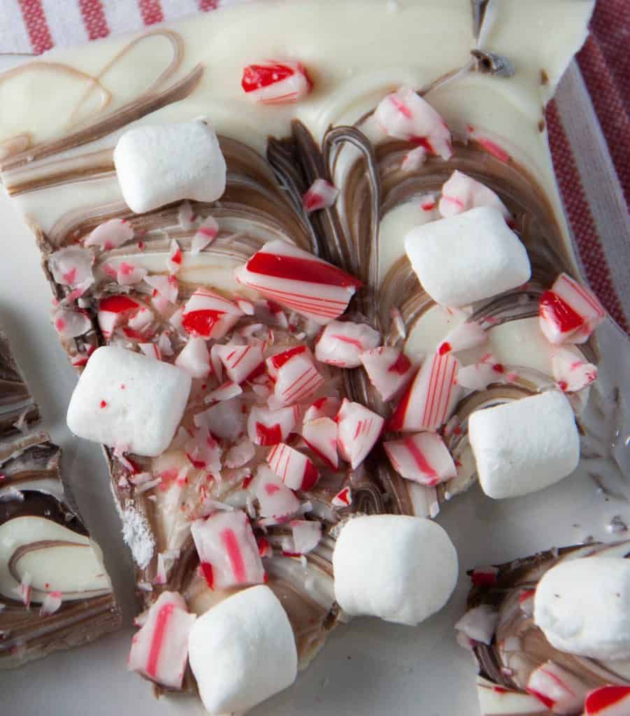 white chocolate candy bark topped with candy canes and mini marshmallows