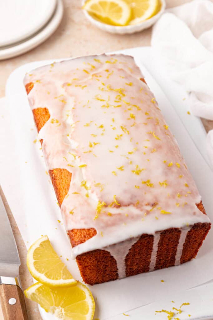 lemon loaf bread with lemon glaze drizzled over
