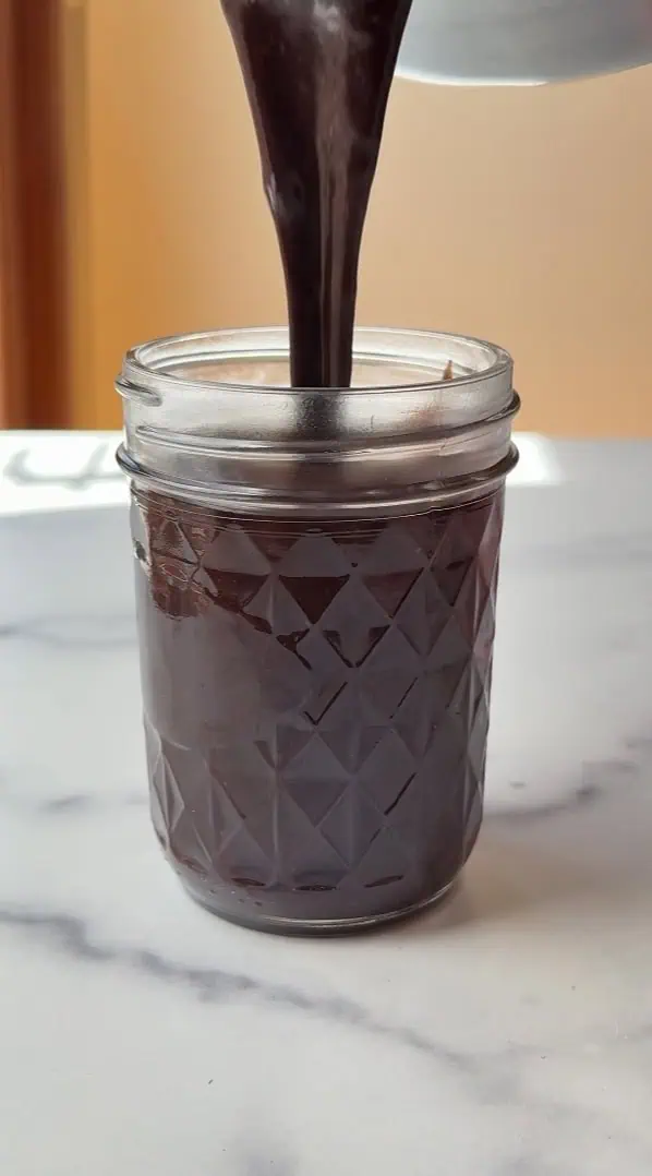hot fudge poured into a container