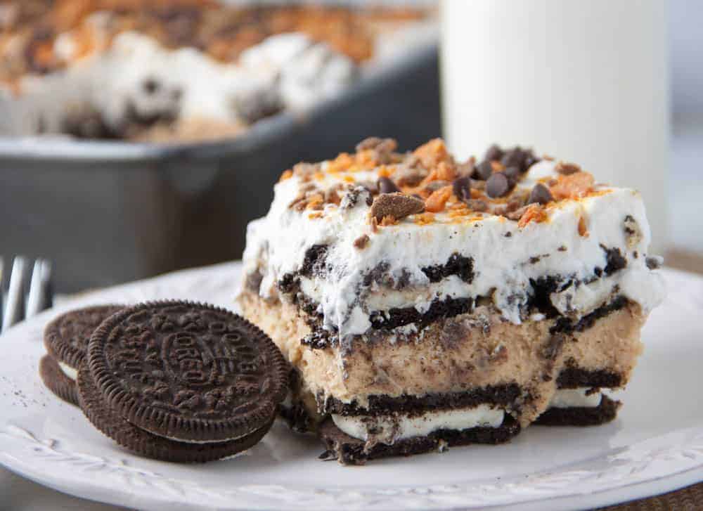 slice of no bake oreo cake with oreo cookies