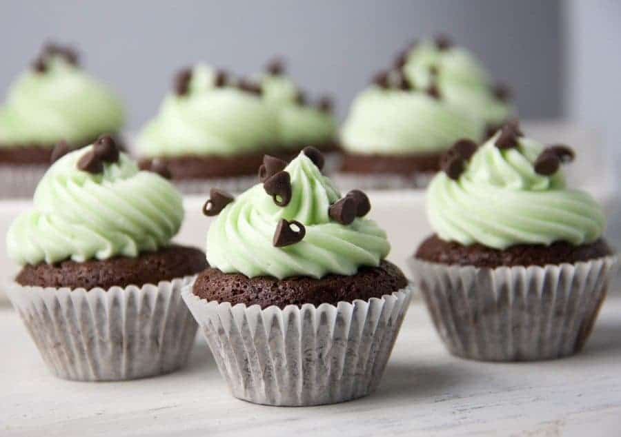mini brownie bites with green mint frosting and mini chocolate chips