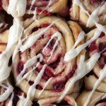 Raspberry Sweet Rolls made 100% from scratch, lemon zest, and fresh lemon juice in the cream cheese glaze on top. Perfect for Mother's day any given Sunday brunch!