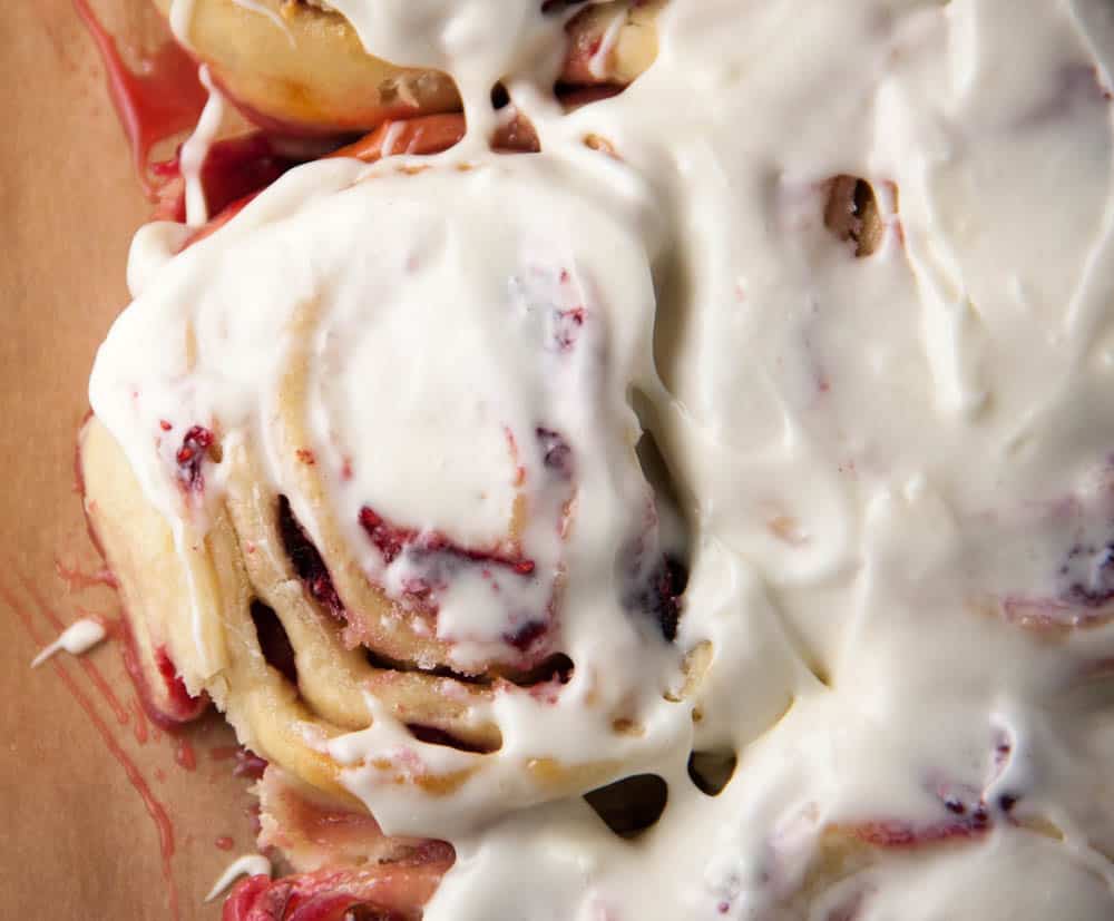 Raspberry Sweet Rolls made 100% from scratch, lemon zest, and fresh lemon juice in the cream cheese glaze on top. Perfect for Mother's day any given Sunday brunch!