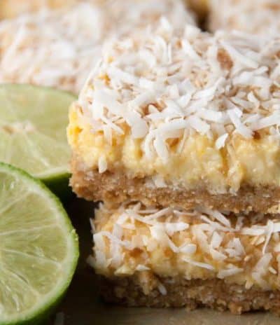 Perfect treat for Cinco De Mayo! A coconut shortbread crust with a tequila lime filling and topped off with more toasted coconut!