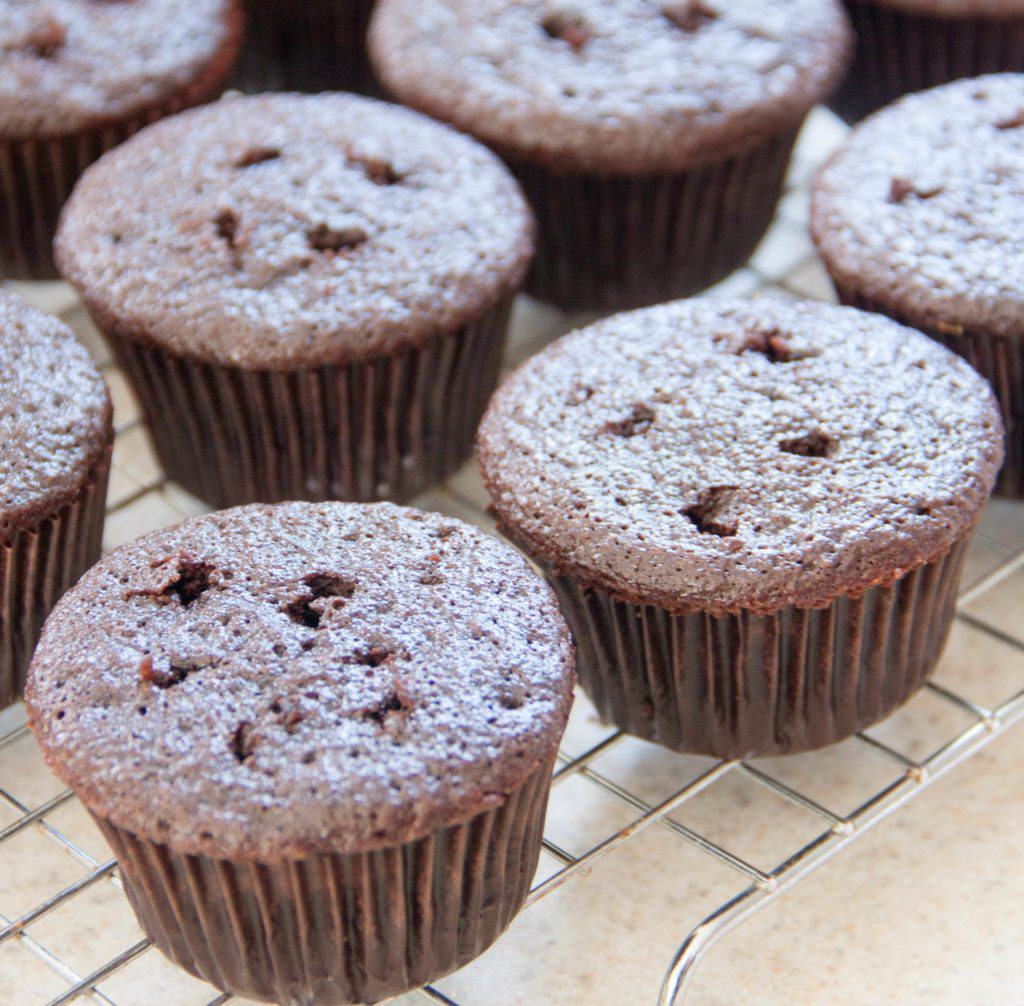 chocolate cupcakes with holes poked in the tops