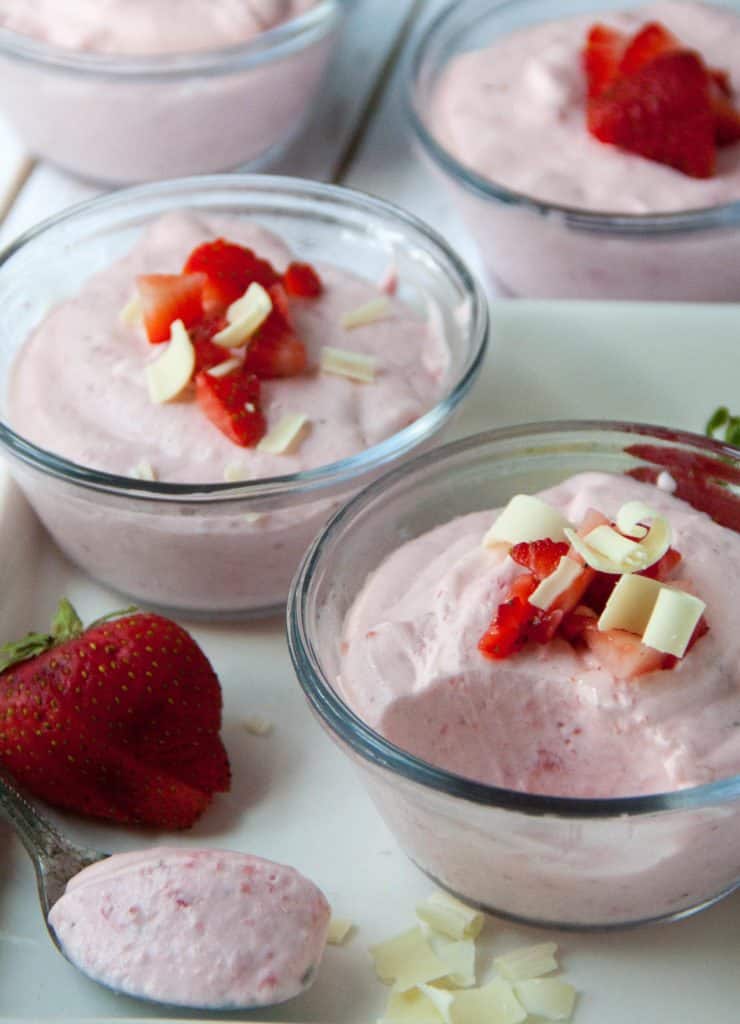 three small dishes of strawberry mousse