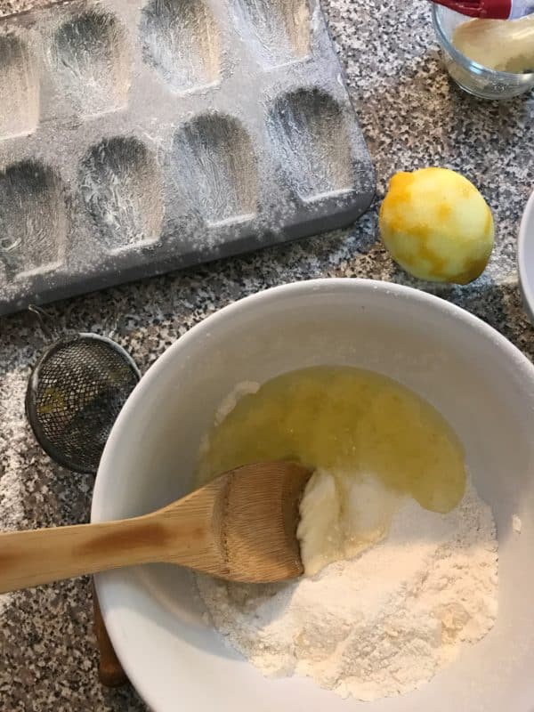 bowl of egg whites being stirred into dry ingredients