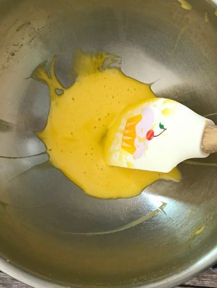 Egg Yolks in a bowl with a spatula