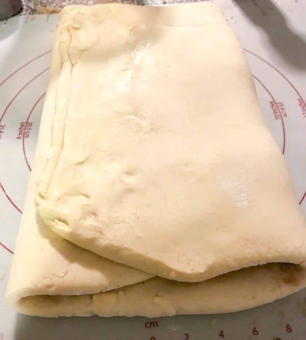 brioche cinnamon roll dough folded in thirds