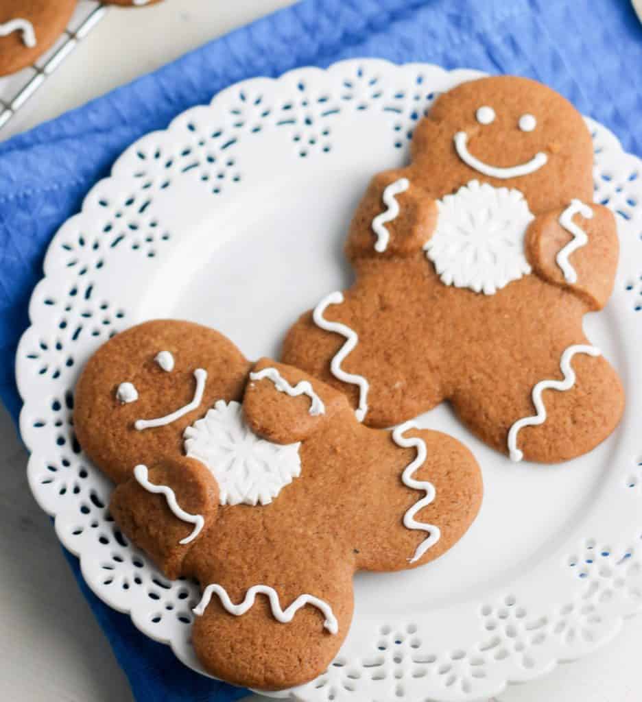 two gingerbread cutout cookies on a plate