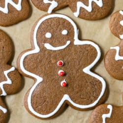decorated gingerbread man cookie on a baking sheet