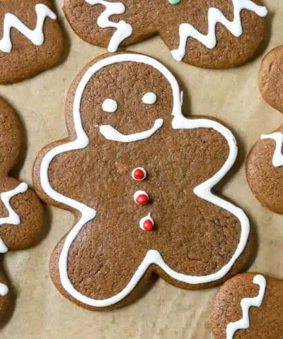 decorated gingerbread man cookie on a baking sheet