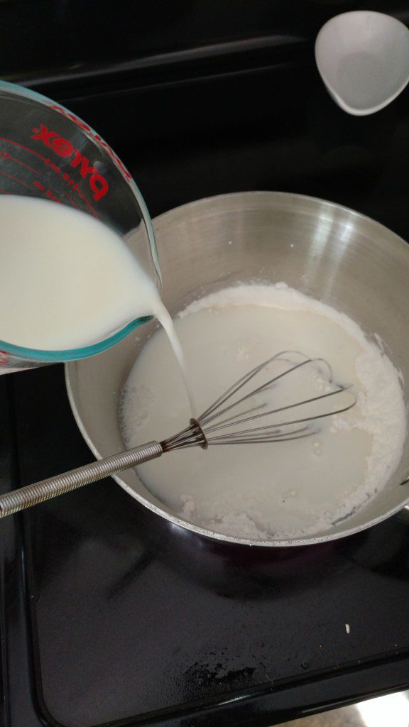 milk whisked into saucepan