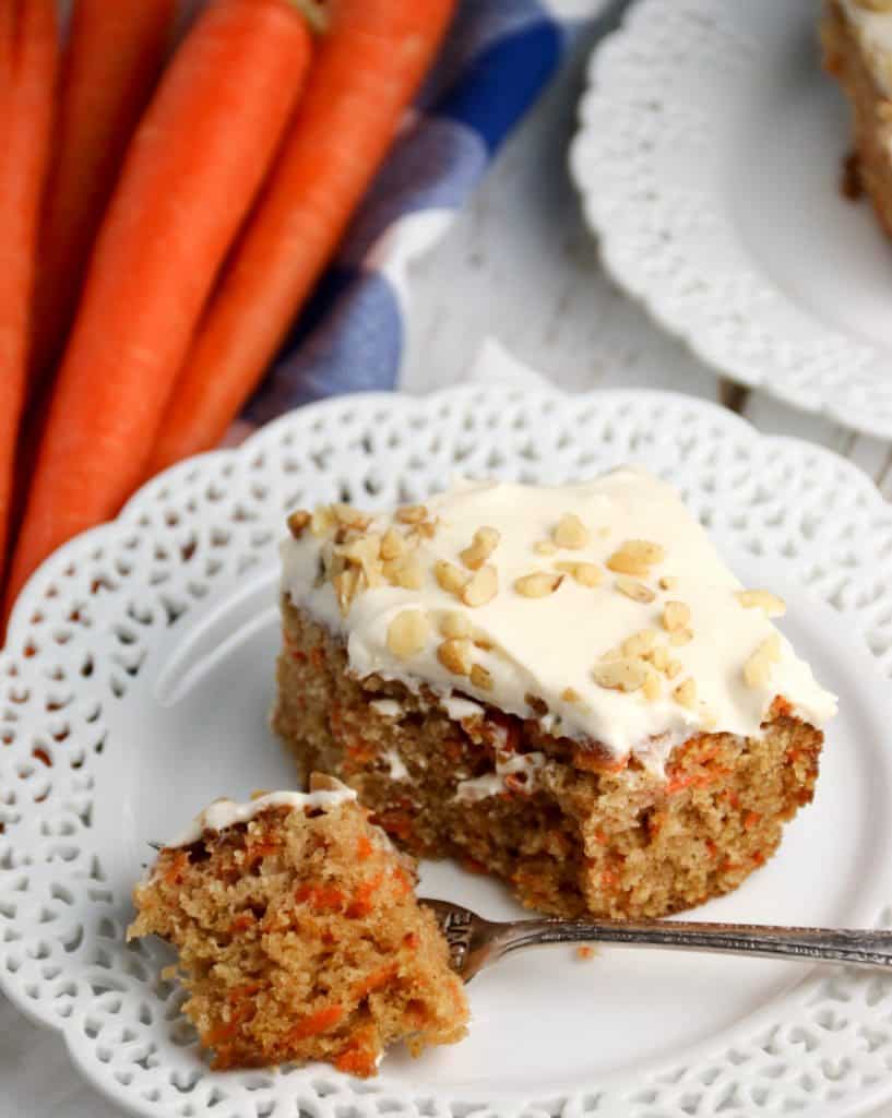 slice of carrot sheet cake on a plate with a fork