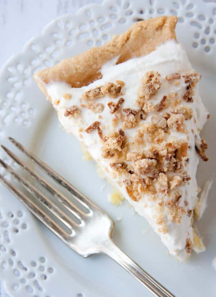 a slice of old fashioned coconut cream pie on a plate