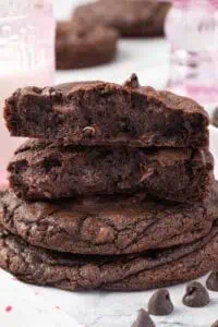 three cookie stacked with the top cookie broke in half