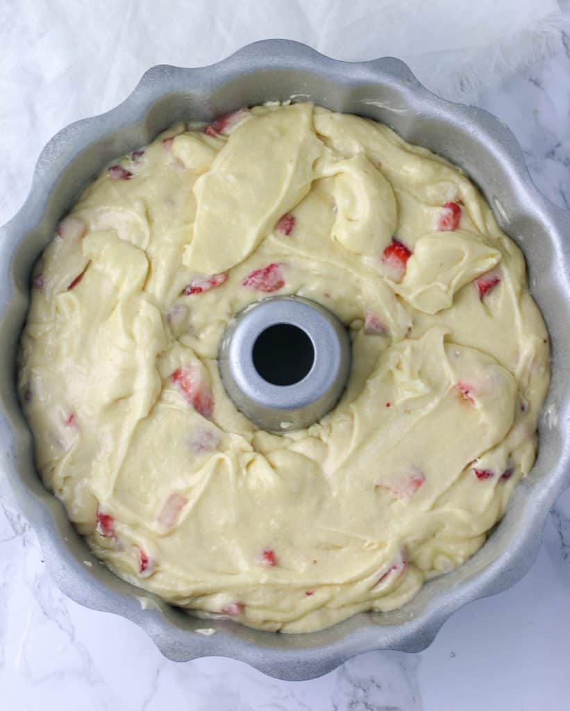 strawberry pound cake batter in bundt pan