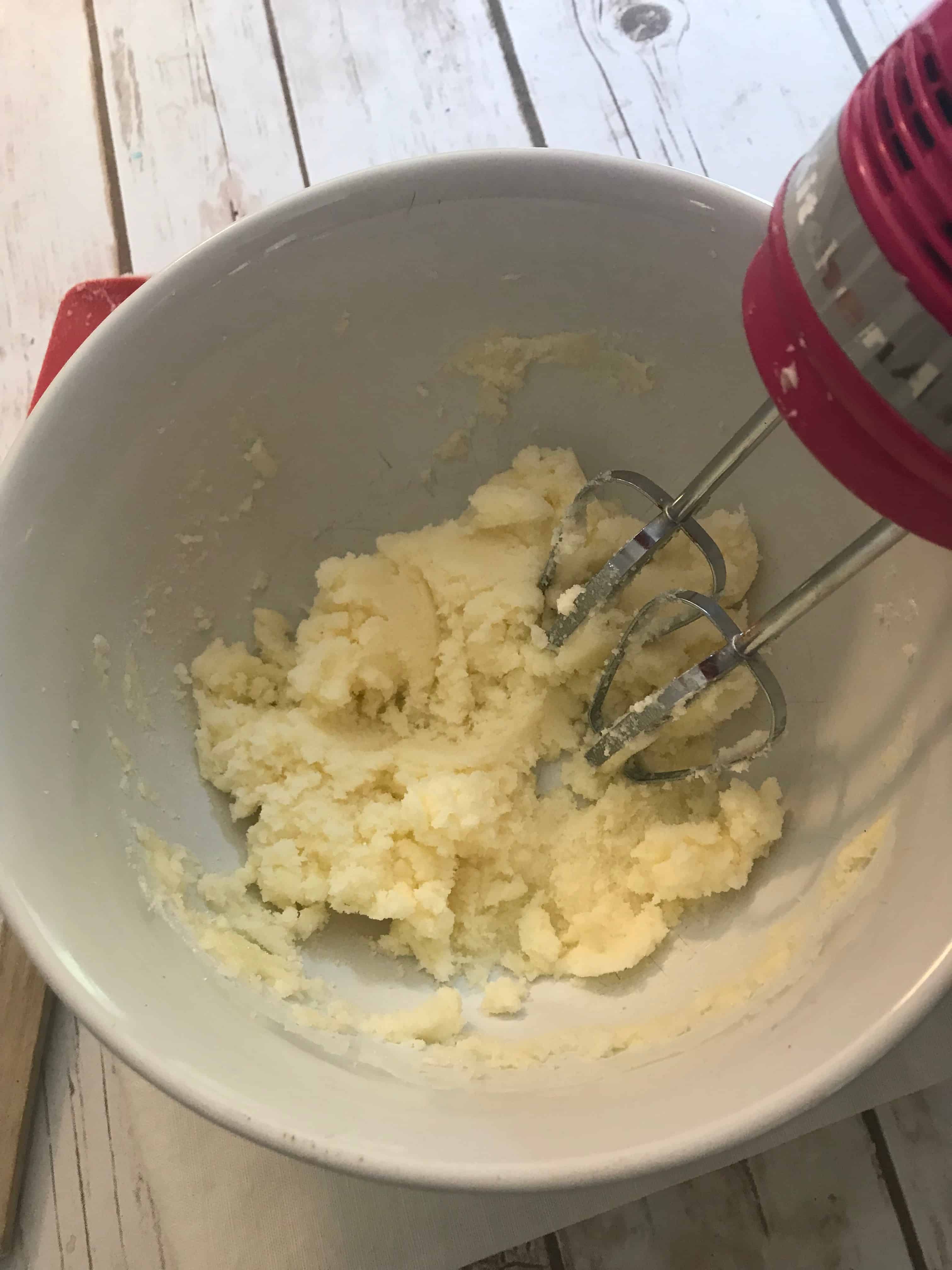 hand mixer creaming butter and sugar together