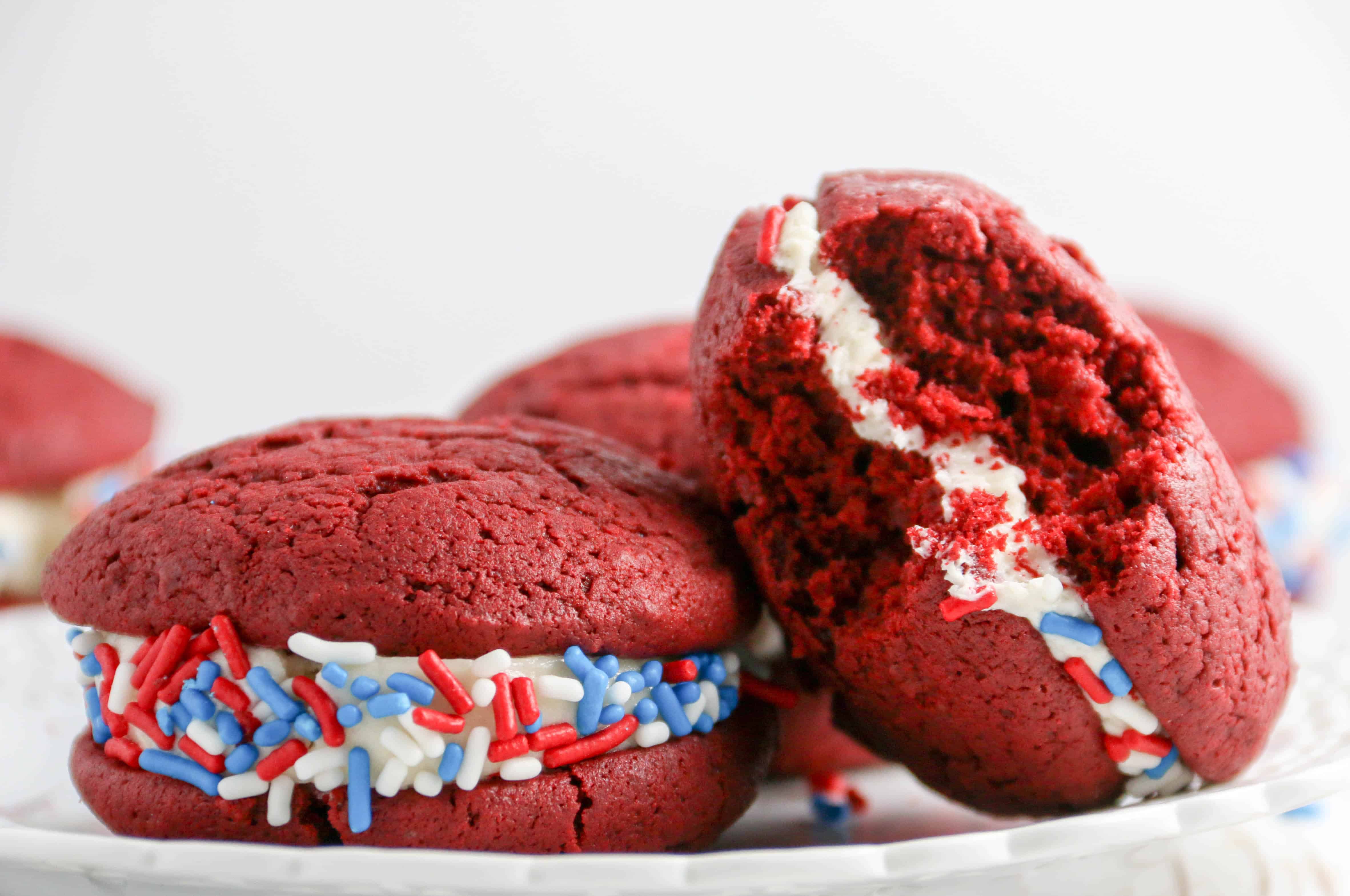 2 red velvet whoopie pies on a plate