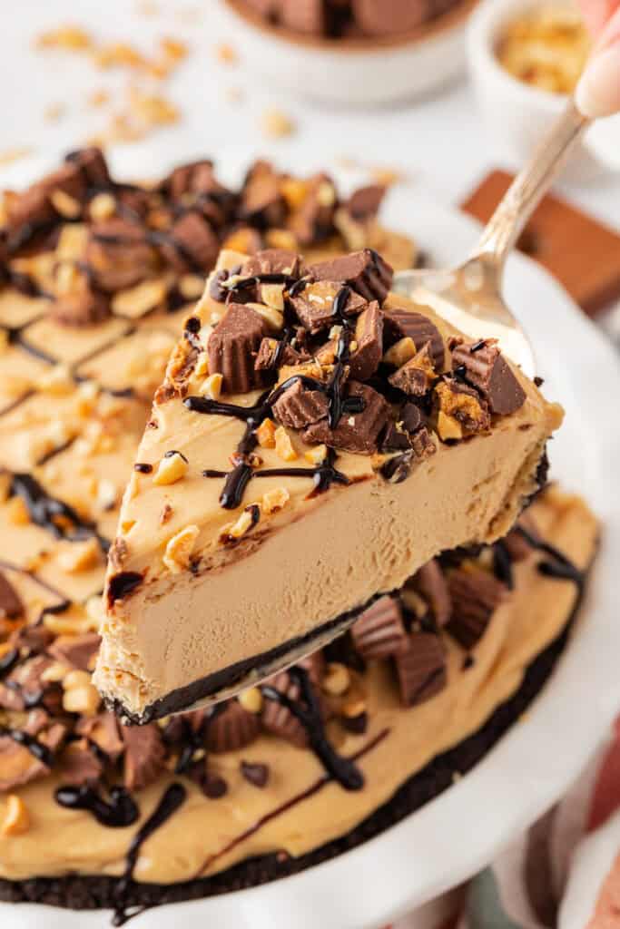 cake server holding a slice of no bake peanut butter pie