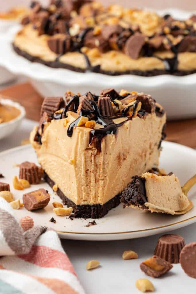 No Bake Peanut Butter Pie slice of no bake peanut butter pie on a plate with bite missing