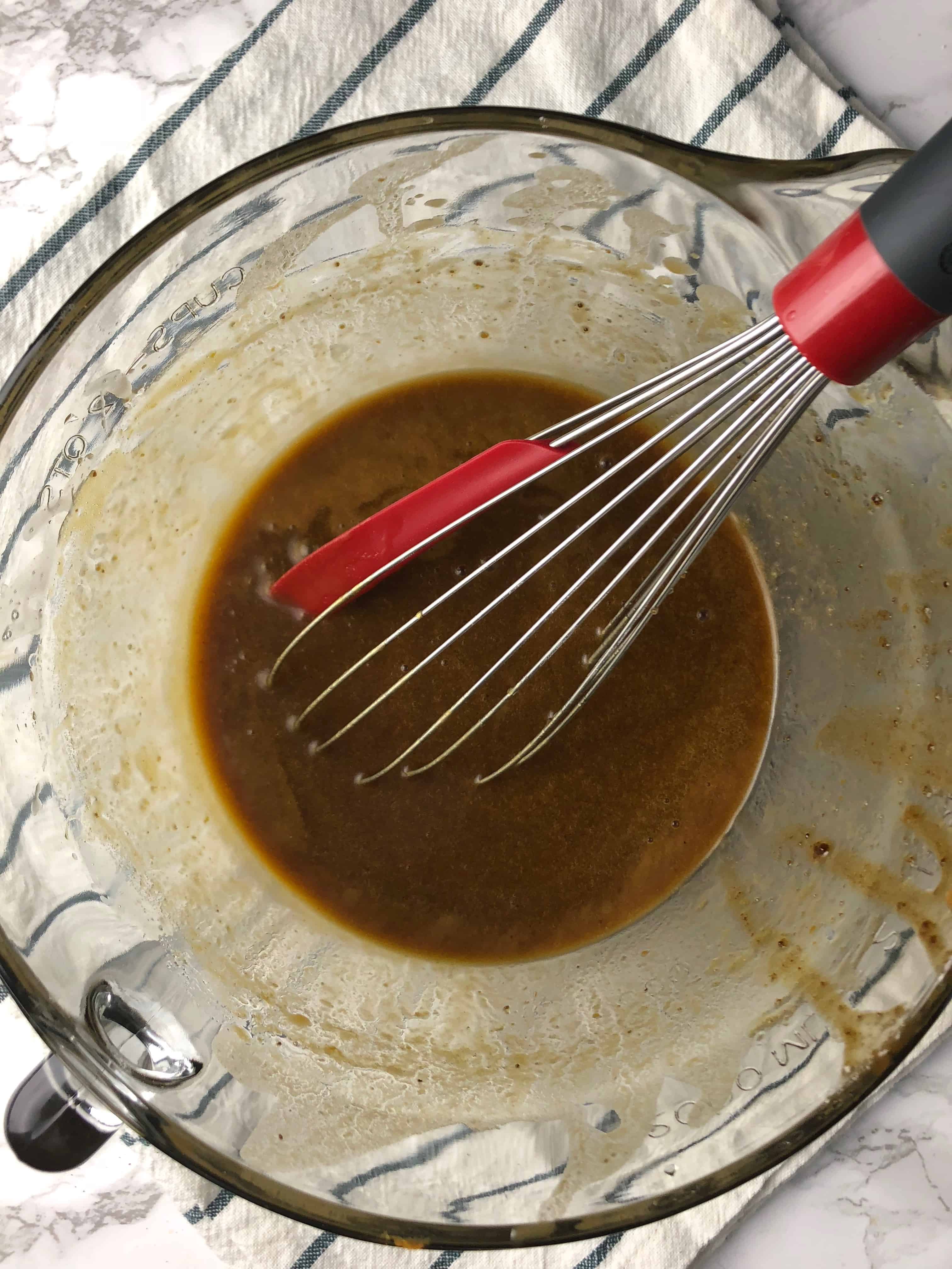 bow of wet ingredients with a whisk