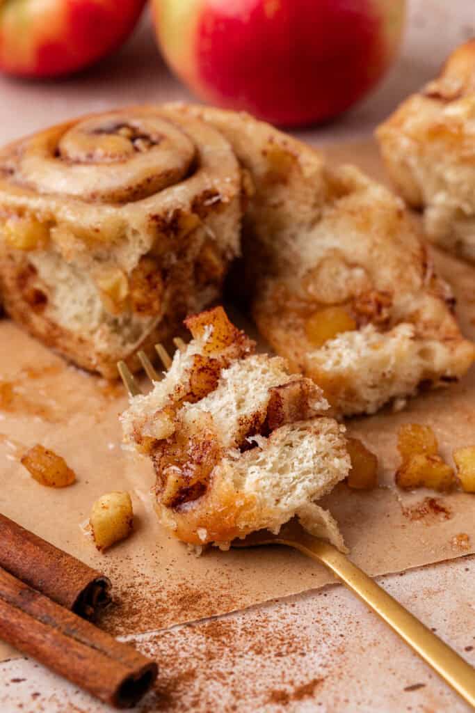Apple Cinnamon Rolls one apple cinnamon roll with a fork