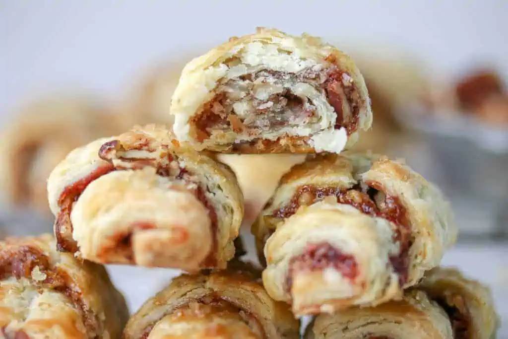 raspberry rugelach cookies stacked on top of each other