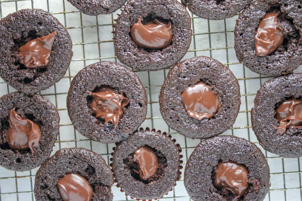 death by chocolate cupcakes with centers cut out and filled with ganache