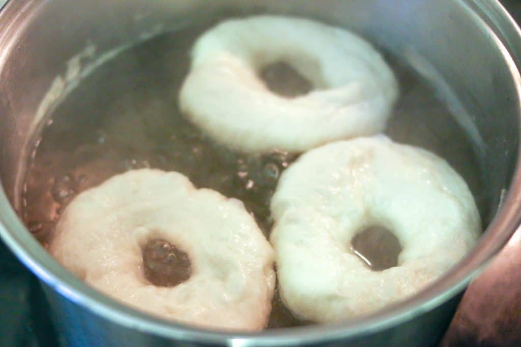 3 bagels boiling in water