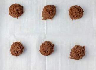 scoops of chocolate cookie dough on parchment