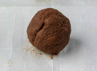 chocolate rolo cookie dough rolled into a ball