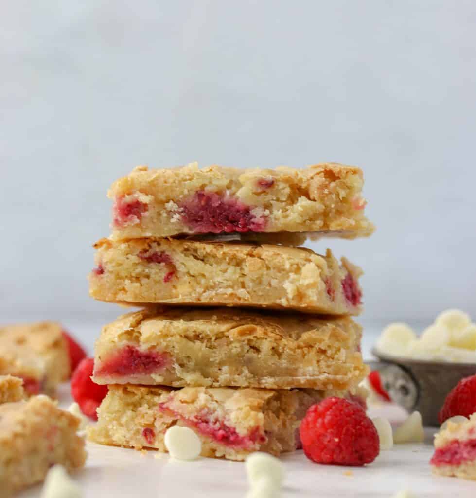 a stack of white chocolate raspberry blondies