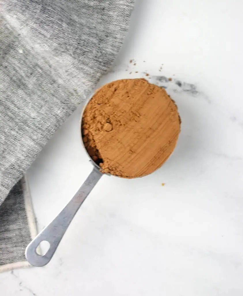 a measuring cup of cocoa powder