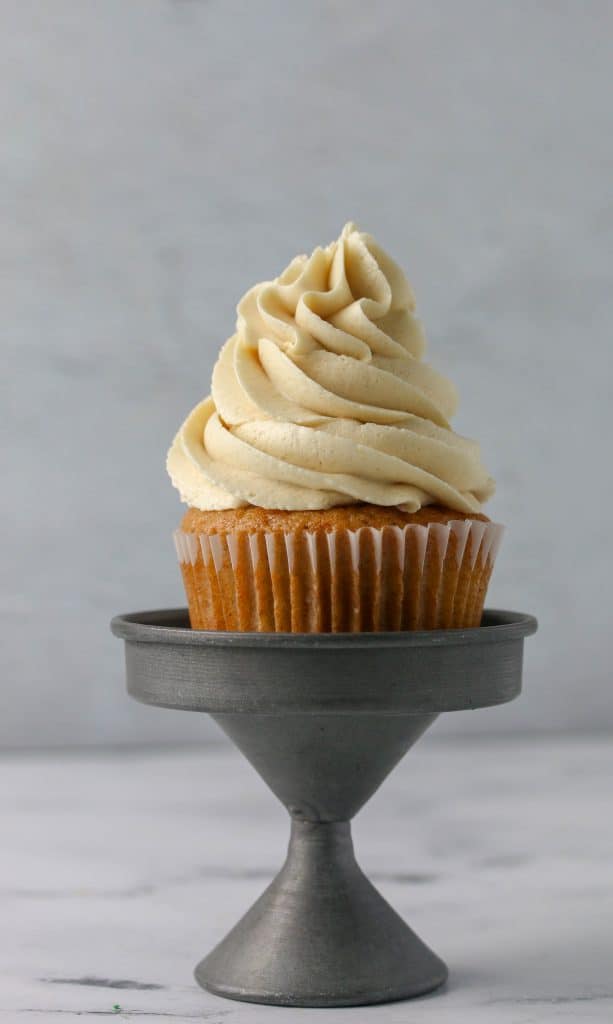 cupcake with brown sugar buttercream on a small cupcake stand