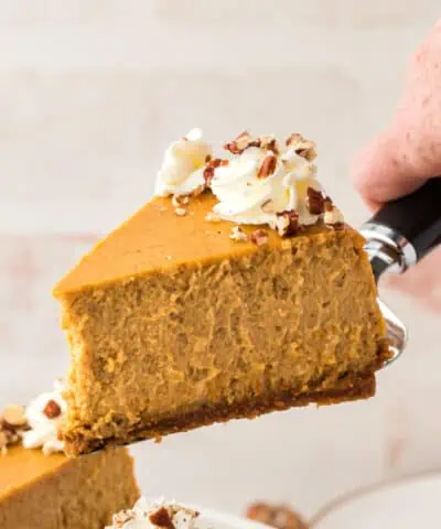 slice of pumpkin cheesecake being served on a spatula