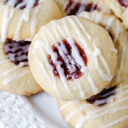 raspberry thumbprint cookies on a plate