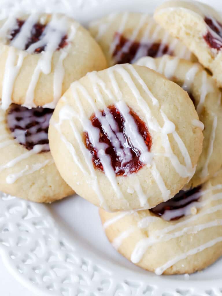 raspberry thumbprint cookies on a plate