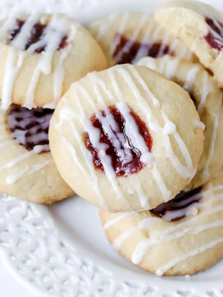 raspberry thumbprint cookies on a plate