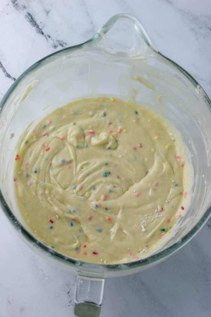 milk bar cake batter with sprinkles in a bowl