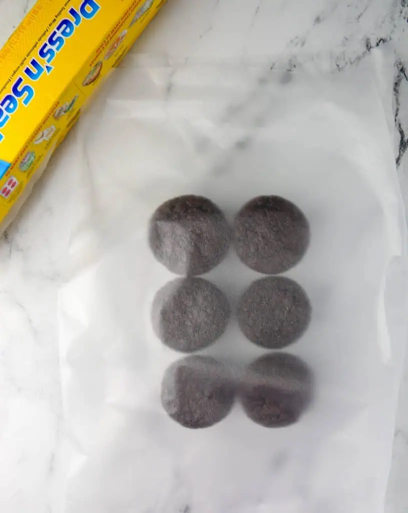 chocolate cupcakes between two pieces of plastic wrap